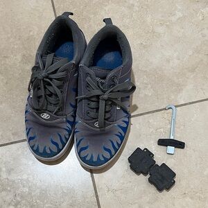 Boys Heelys tennis shoes, size 5. Grey with blue flame. Plugs & tool included.